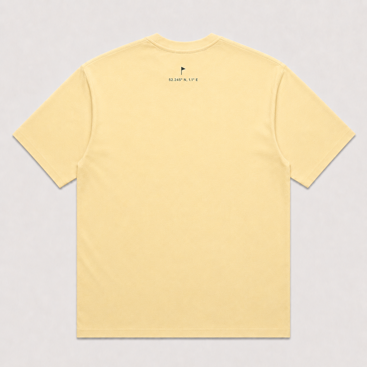 EASTERN Opening Round Tee in Butter, back view showing Suffolk flag and coordinates detail