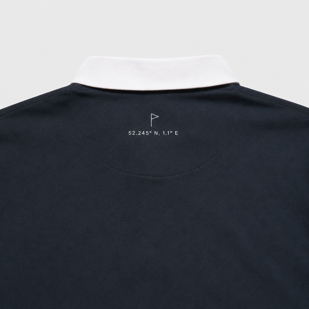Close-up of Suffolk flag and coordinates embroidery on Navy Opening Round Golf Polo
